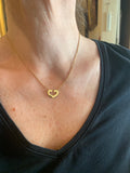 Pendentif / Collier Cartier Coeur et Symbole Or Jaune 18 Carats