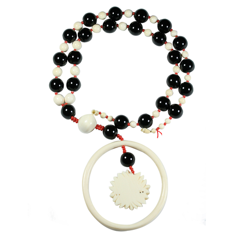 A long antique ivory, onyx and coral necklace